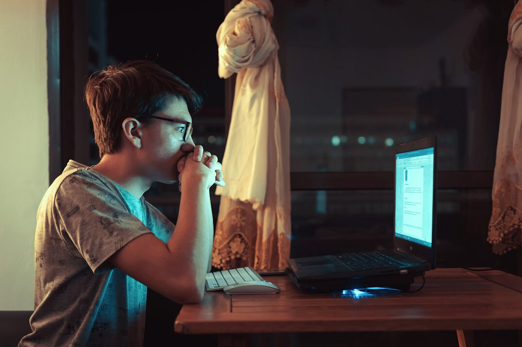mystery writer typing at night