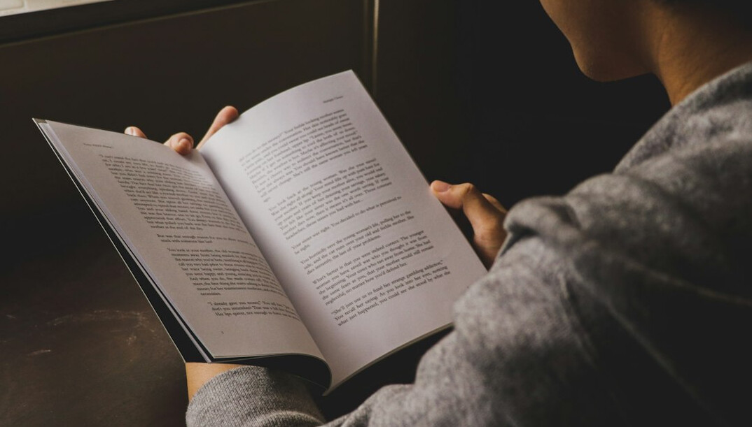 woman reading thriller novel