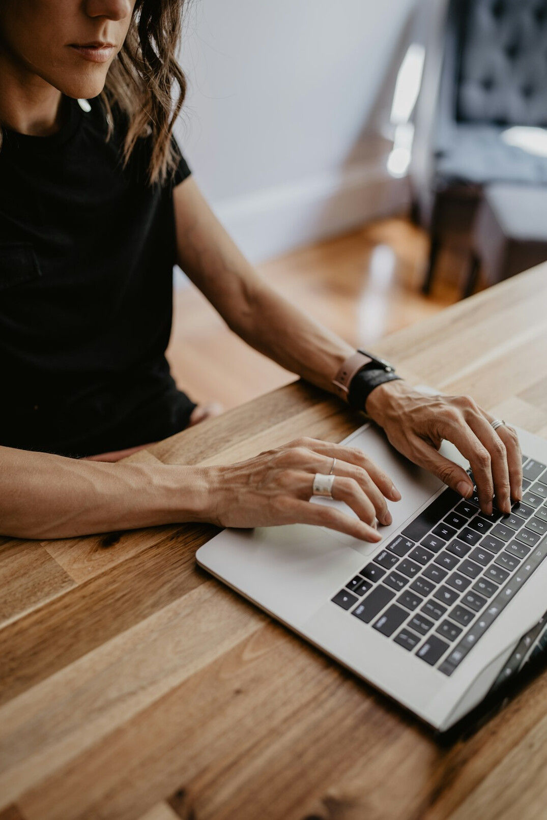 writer typing on laptop